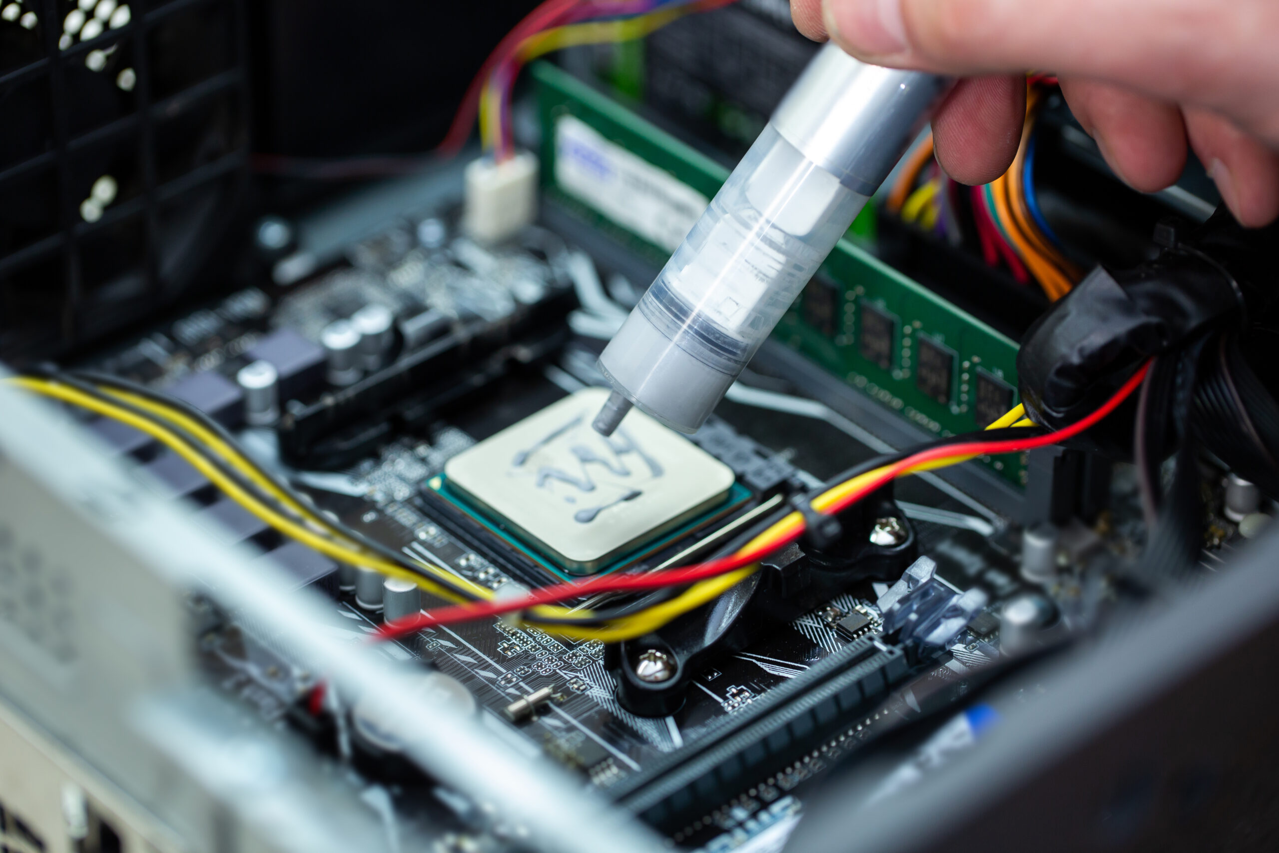 Thermal paste is applied to the laptop processor.